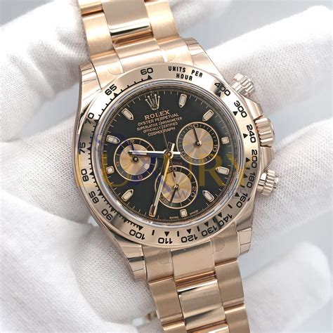 rolex daytona gold silver black dial|Rolex daytona gold black face.